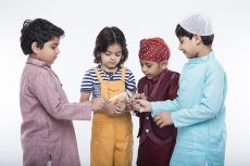 kids lighting candles