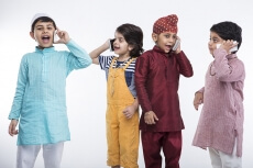 kids from different religions with mobile phones 