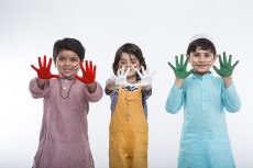 kids from different religion with colourful hands 