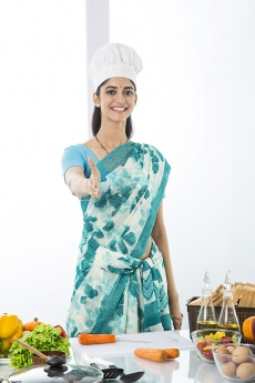 indian housewife posing in shake hand gesture