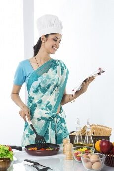 housewife cooking from recipe