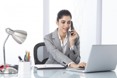 corporate woman talking while working 