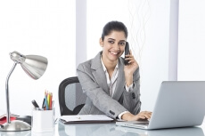corporate woman talking while working 