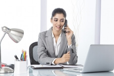 corporate woman talking while working 