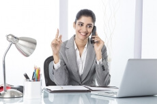 corporate woman talking while working 