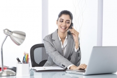 corporate woman talking while working 