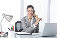 corporate woman talking while working 