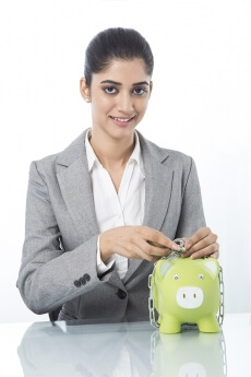 woman in formals with piggy bank 