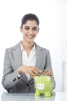 woman in formals with piggy bank 