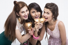 three girls eating ice cream