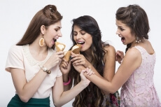 three girls eating ice cream