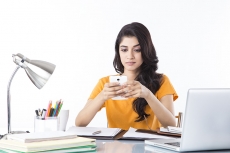 girl talking on phone while studying