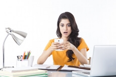 girl talking on phone while studying
