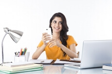 girl talking on phone while studying