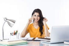 girl talking on phone while studying