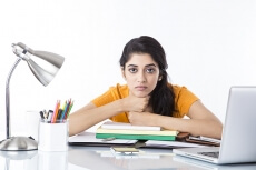 girl feeling sleepy after studying