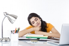 girl feeling sleepy after studying