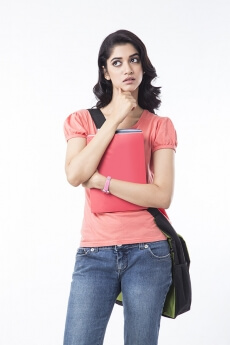 college girl holding text books and posing