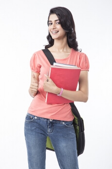 college girl holding text books and posing