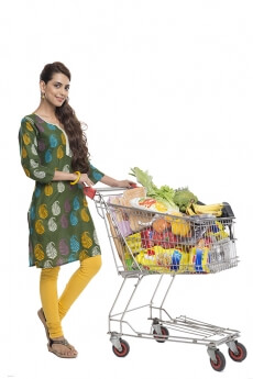 Indian woman posing with shopping kart