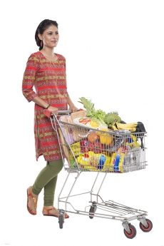 Indian woman posing with shopping kart