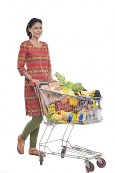 Indian woman posing with shopping kart