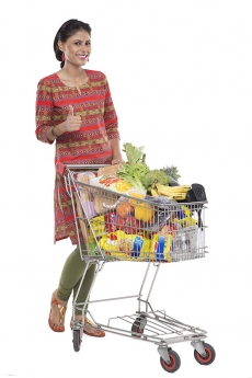 Indian woman posing with shopping kart