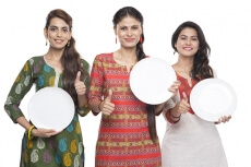 housewife holding with white plate