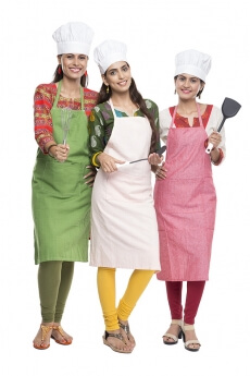 women wearing apron with kitchen utensils