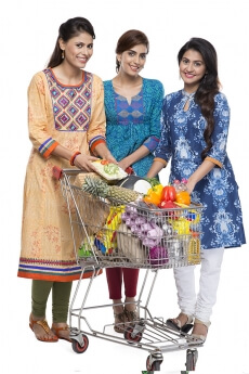 Indian woman posing with shopping kart
