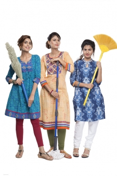 woman holding mop duster and grass broom