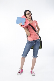 college girl holding text books and posing