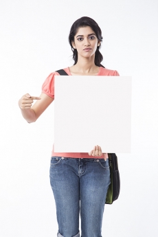 young college girl pointing at message board