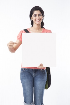 young college girl pointing at message board