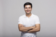 Man standing with hands folded