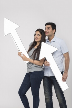 Portrait of a happy family smiliing and posing with placard