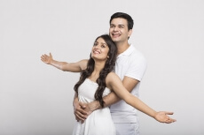 loving couple with open raised their hands