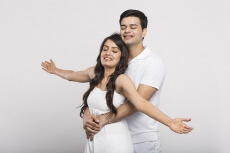 loving couple with open raised their hands