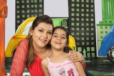happy mother and girl enjoying in the park