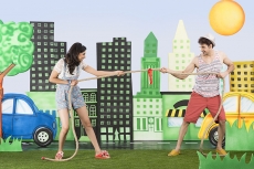 couple pulling rope in the park