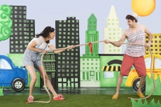 couple pulling rope in the park