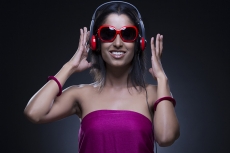 young girl posing red head phone and sunglasses