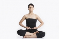 young woman doing yoga exercise