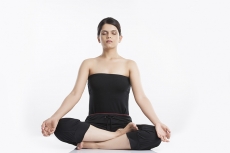 young woman doing yoga exercise