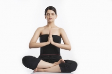 young woman doing yoga exercise