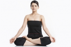 young woman doing yoga exercise