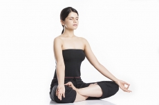 young woman doing yoga exercise