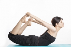 young woman yoga exercise practicing dhanurasana,girl sitting in yoga 