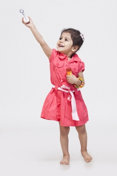 Little girl playing with bubble toy