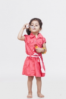 Little girl playing with bubble toy